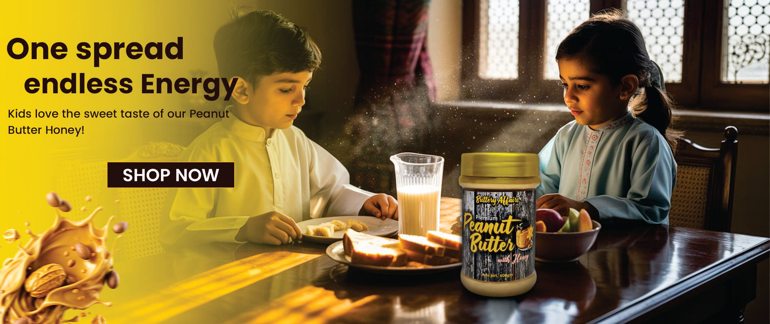 Two children sitting at a table with a jar of Peanut Butter Honey and a glass of milk.
